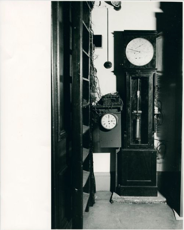 black and white image of two historical clocks